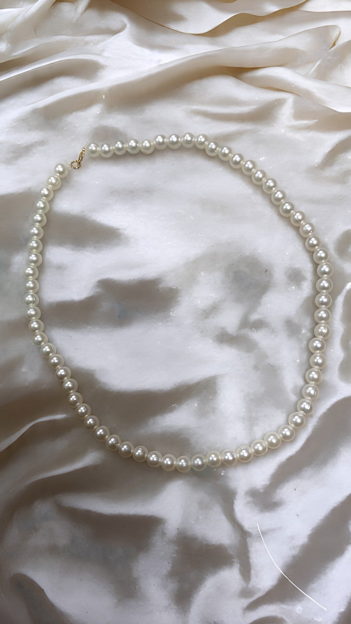 Single chain pearl necklace